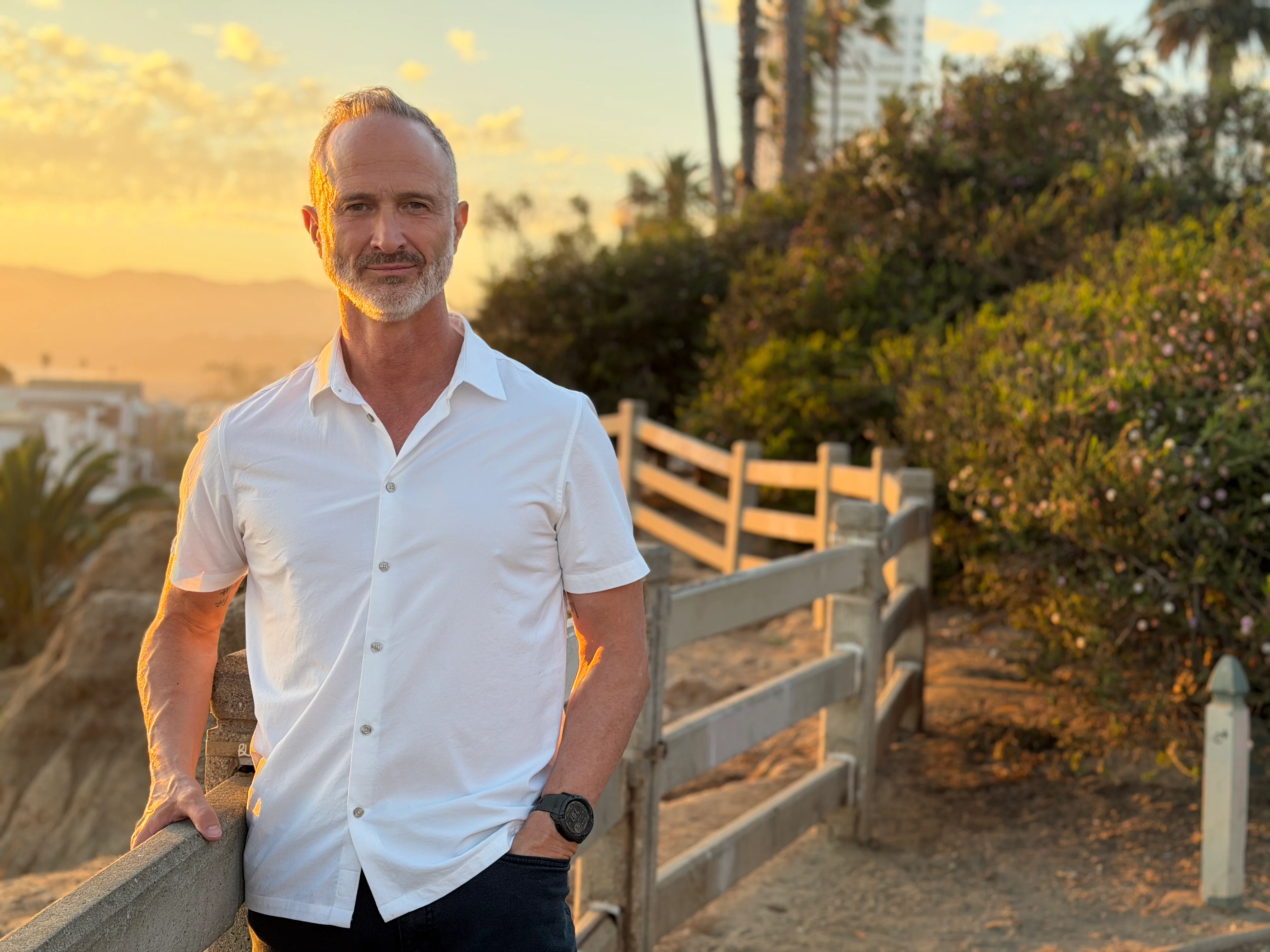 Doug Dolan looking forward outdoors at golden hour