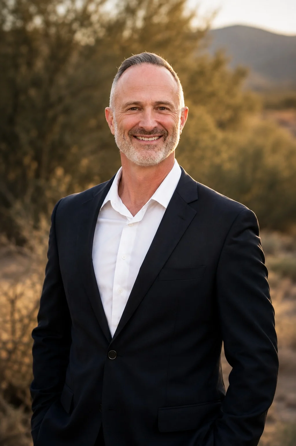 Doug Dolan in a dark blazer outdoors
